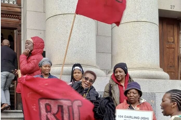 Residents of Darling Street show relief after judgement in the urgent eviction application was reserved. Image: supplied